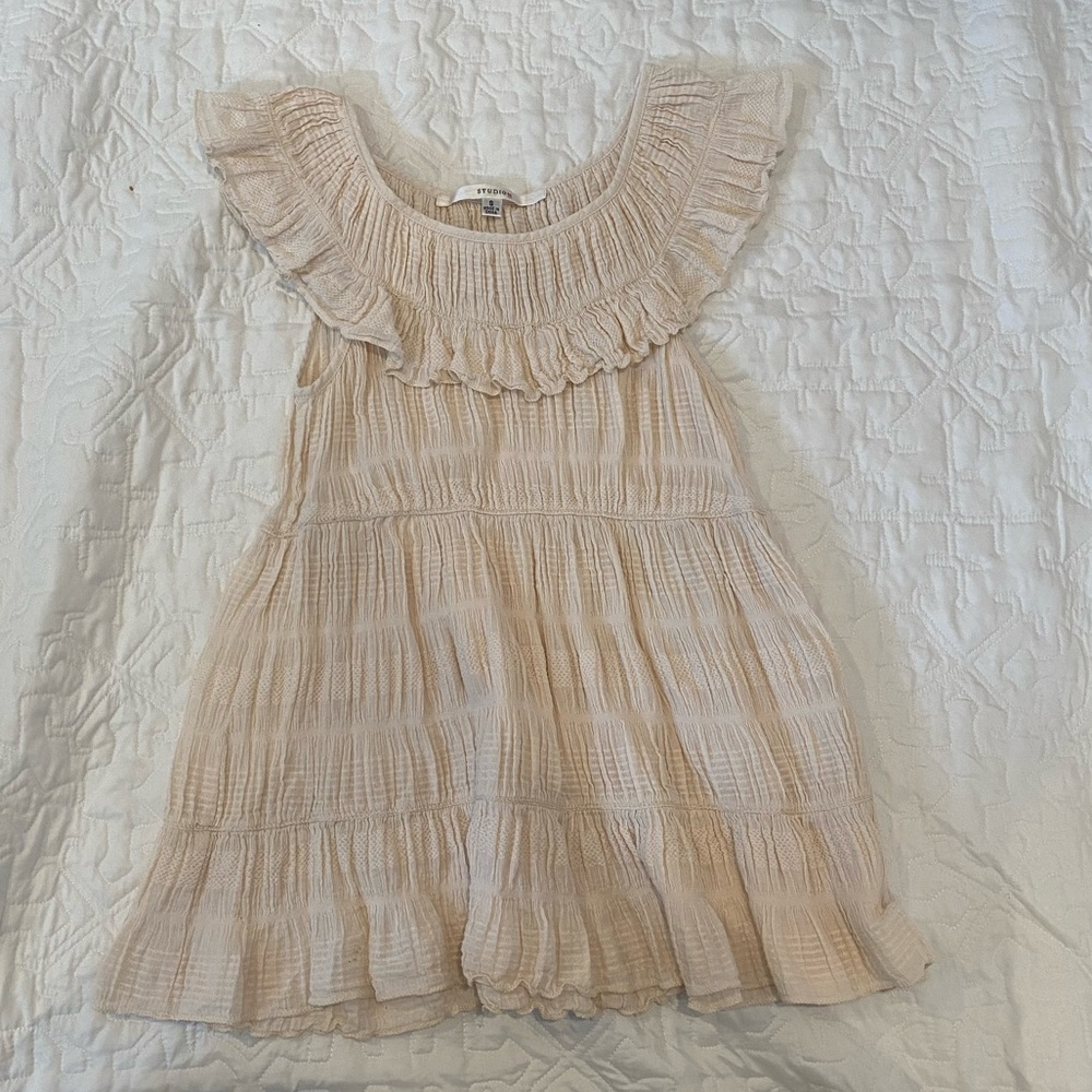 Ruffly cream tank top! 🍦🧴
